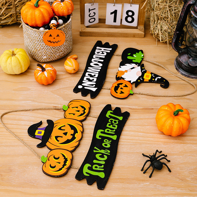 Halloween Trick or Treat hanging decor with pumpkins, a gnome, and a spider.