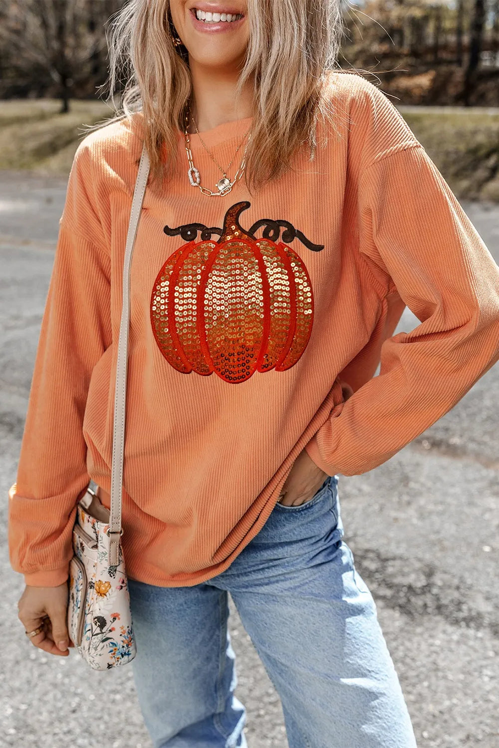 Orange sequin pumpkin long sleeve sweatshirt.