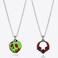Two-piece Halloween theme necklace set with a green poison apple and a red bat pendant.