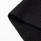 Close-up of a black ribbed knit fabric.