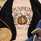 A light-colored t-shirt with a "Pumpkin Patch Girl" graphic and a black cardigan.