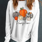 White round neck sweatshirt with a pumpkin graphic.