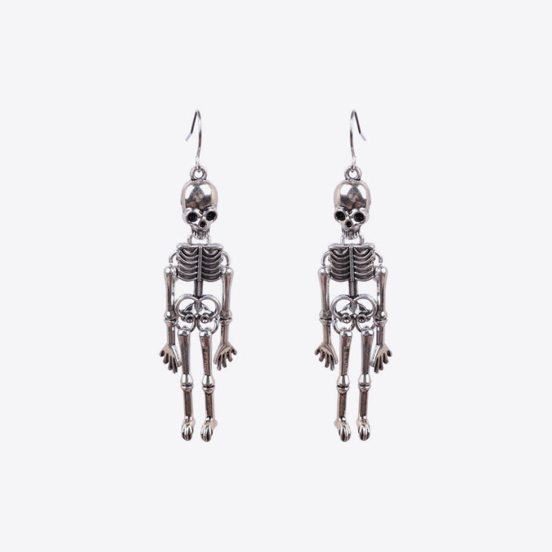 Two silver-colored skeleton alloy earrings hang against a white background.