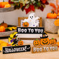 Assorted Halloween ornaments including ghosts, pumpkins, and witches on wooden blocks.