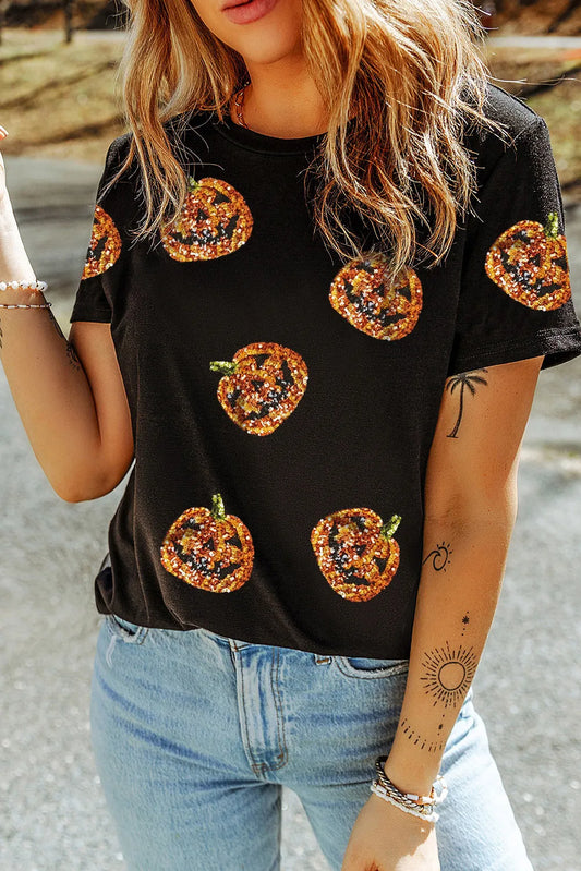 Black short-sleeve t-shirt with sequin pumpkin designs.
