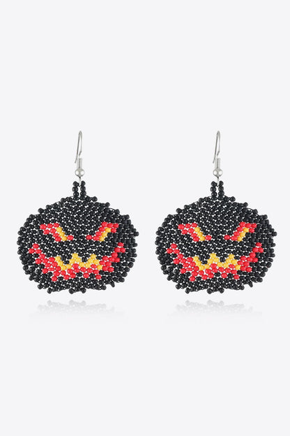 Pair of Halloween-themed beaded earrings in the shape of jack-o'-lanterns.