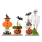 Two wooden Halloween decorations featuring pumpkins, ghosts, bats, and a skeleton.