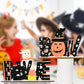 Two wooden Halloween ornaments, one spelling "BEWARE" with a ghost and the other "BOO" with a pumpkin.