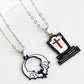 Two-piece Halloween theme necklace set with a bat and a tombstone pendant.
