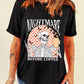 Black tee with a skeleton holding coffee and making a peace sign, with "NIGHTMARE BEFORE COFFEE" text.