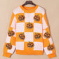 Pumpkin checkered round neck long sleeve sweater with sequin pumpkins.