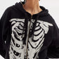 Black zip-up hoodie with a white skeleton rib cage graphic.