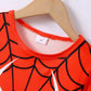 A red spiderweb-patterned children's t-shirt with a "4Y" size tag on a hanger.
