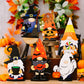 Six wooden Halloween gnome and ghost ornaments are displayed.