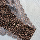 Printed base with wave-shaped edges and triangular-shaped underwear