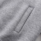 Close-up of a gray hoodie with a vertical pocket opening.
