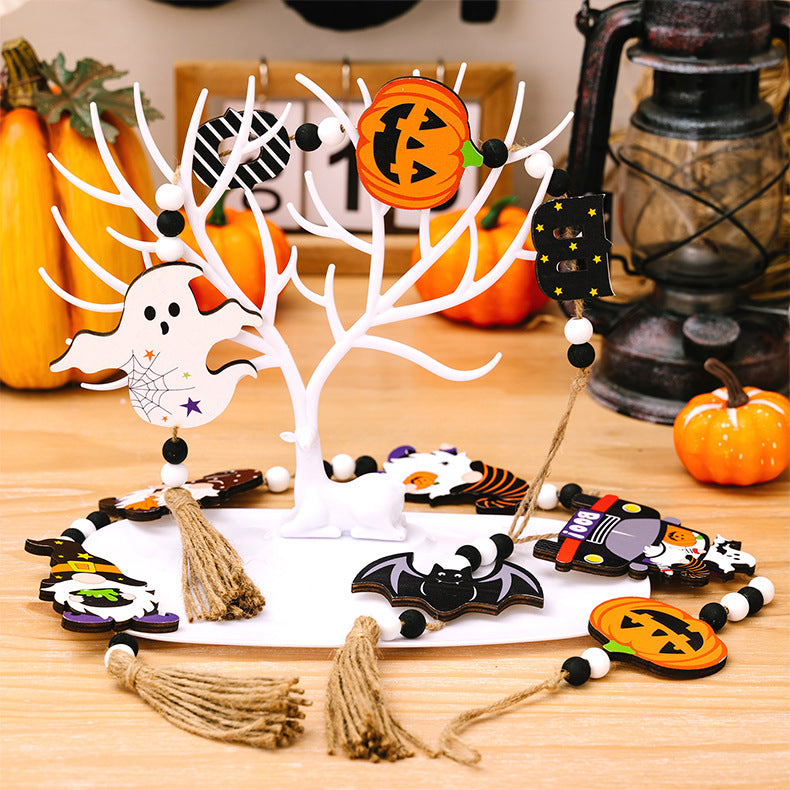 Three Halloween-themed wooden hanging widgets with tassels, featuring a ghost, bat, and pumpkin.