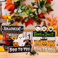Assorted Halloween ornaments including witches, gnomes, ghosts, and pumpkins.