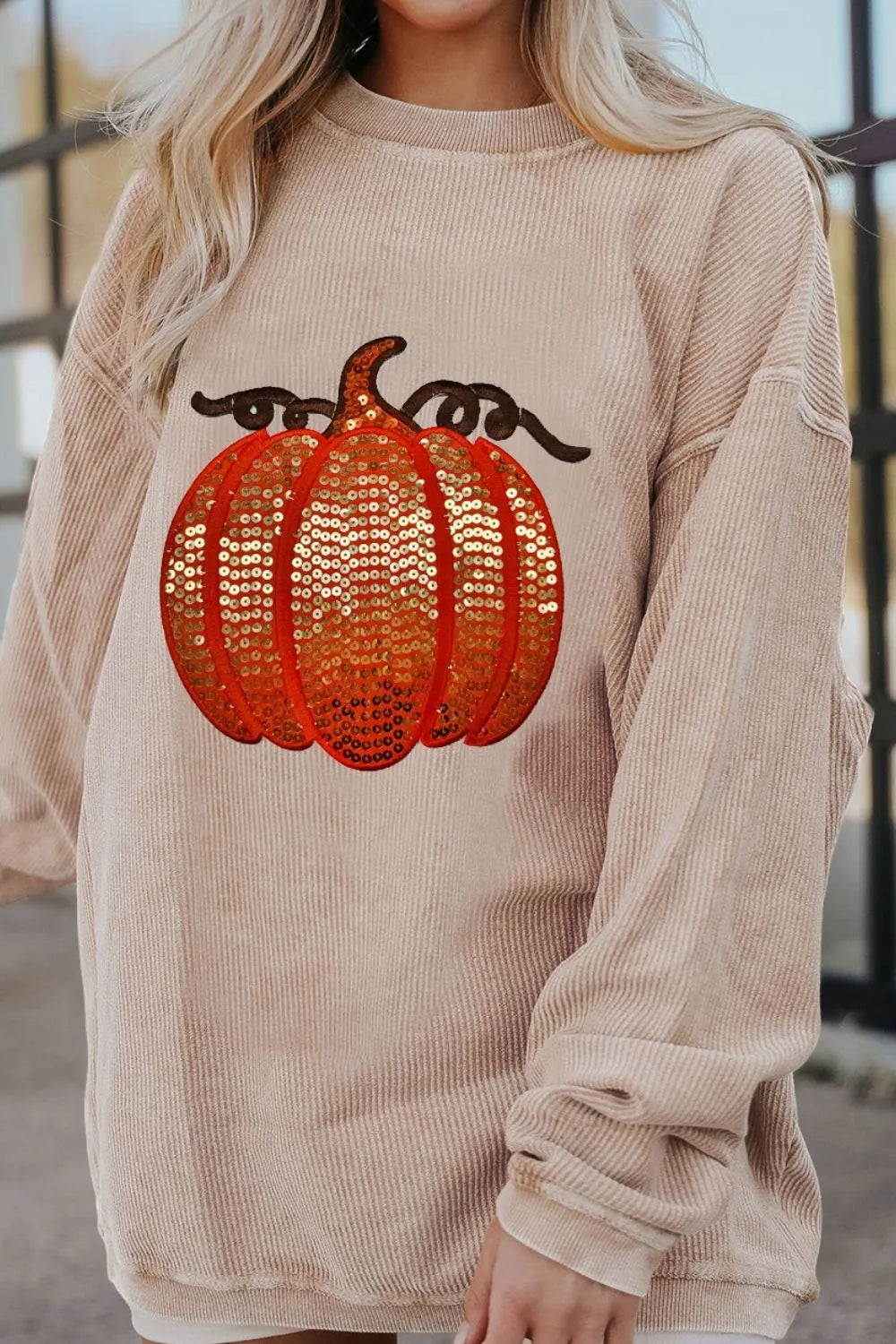 Sequin pumpkin round neck long sleeve sweatshirt.