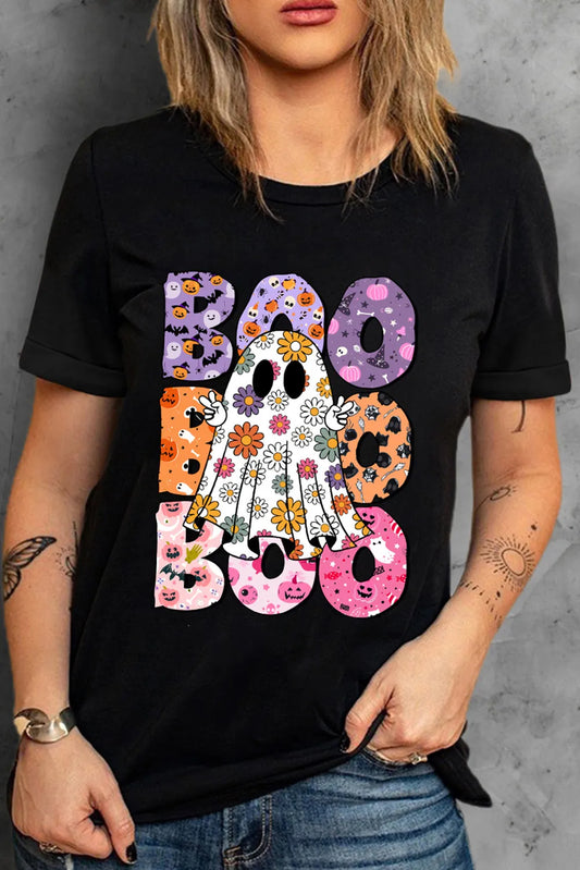 A woman wears a black short-sleeve t-shirt with a colorful "BOO" ghost graphic.