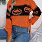 Orange and black pumpkin print long sleeve sweater.