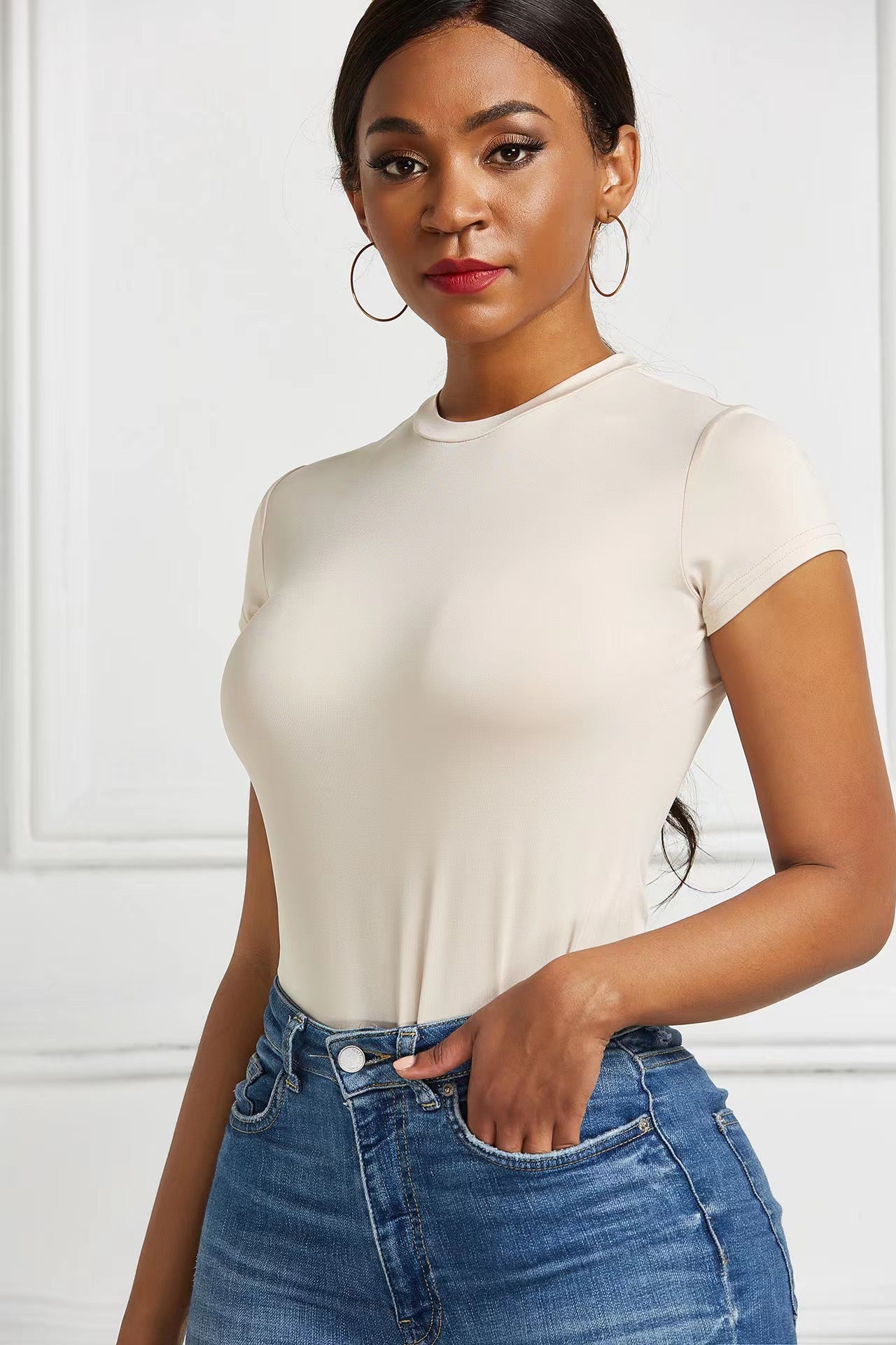 A base layer for a shaping garment