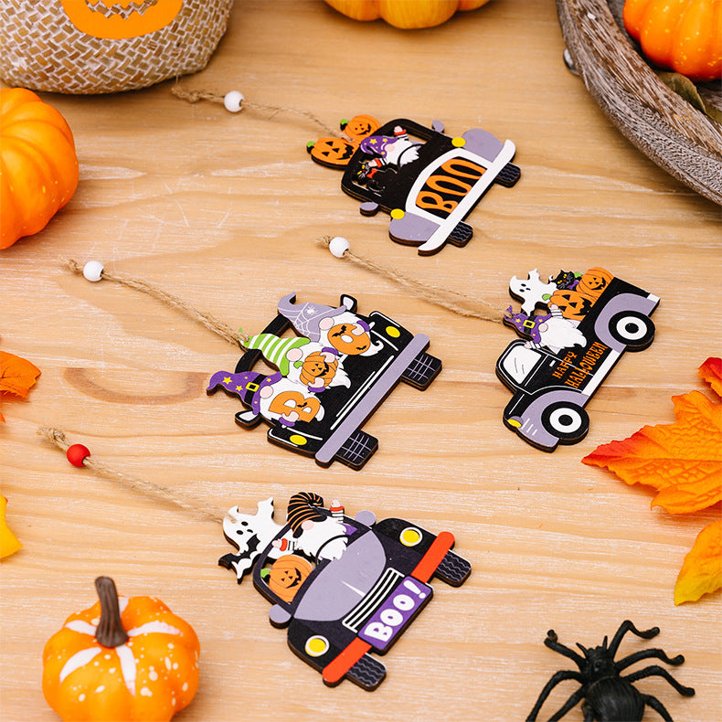 Four Halloween-themed car-shaped wooden hanging ornaments with twine.