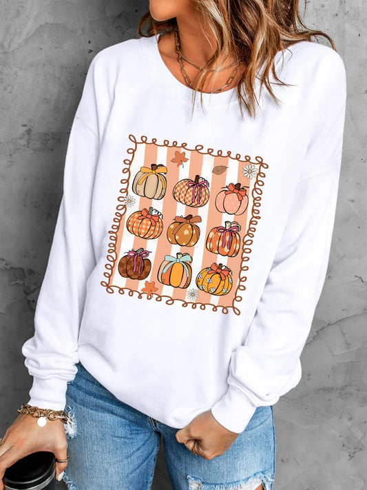 White round neck sweatshirt with a graphic of nine decorated pumpkins.