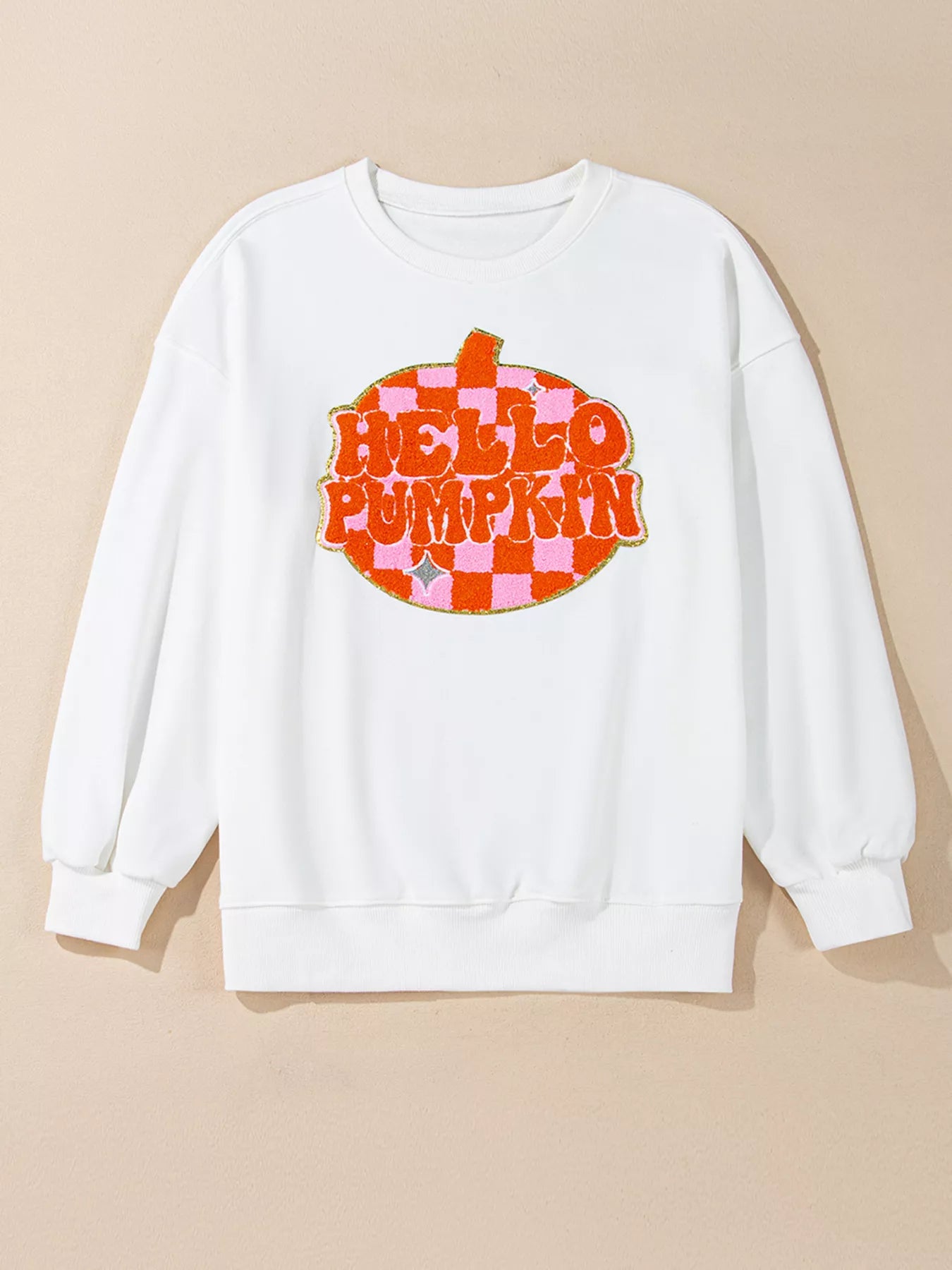 White long sleeve sweatshirt with a "Hello Pumpkin" checkered graphic.