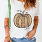 A woman wears a white short-sleeve t-shirt with a leopard print pumpkin design.