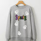 A gray sweatshirt with sequined "Spooky" text and ghost appliques.