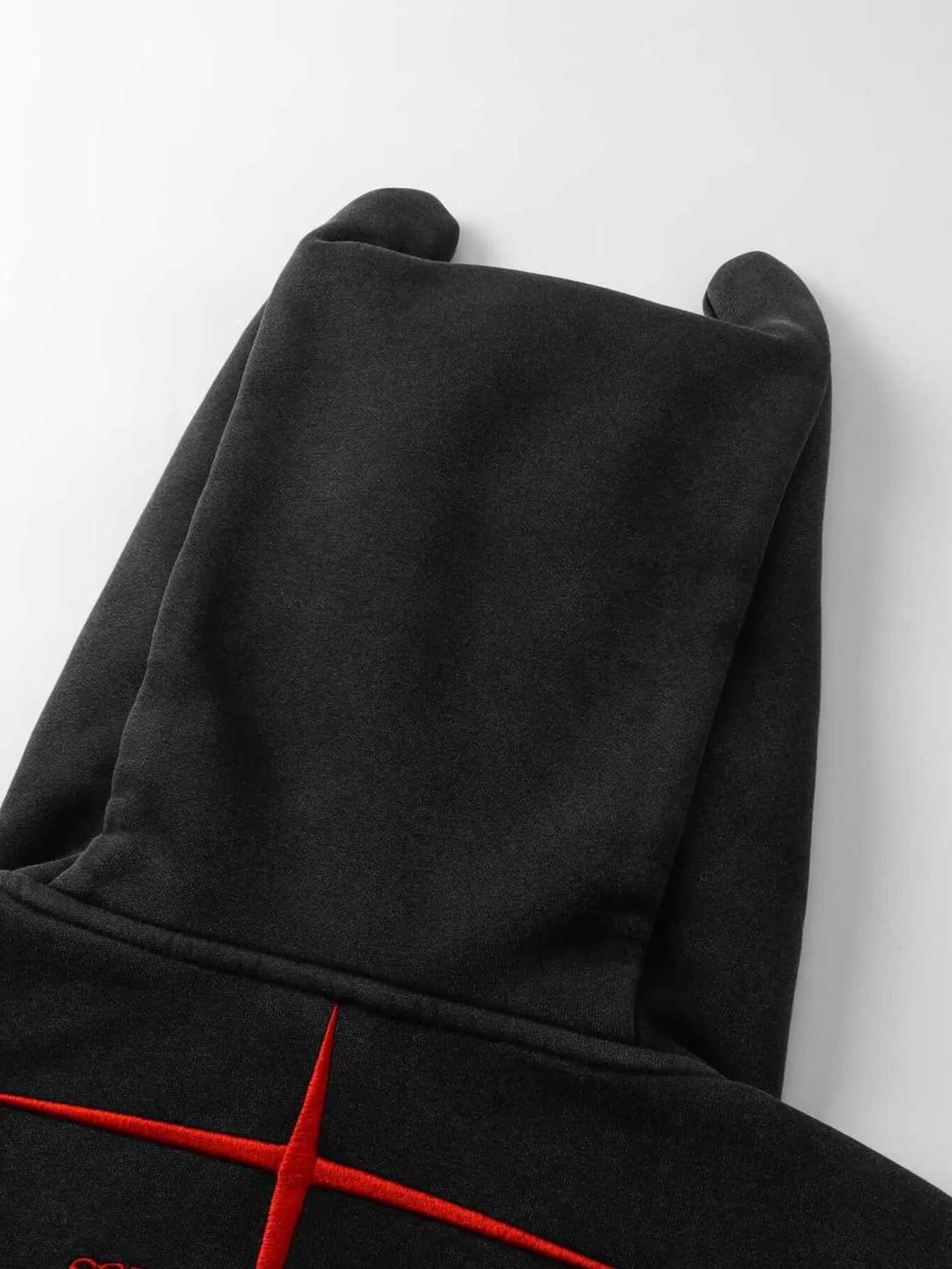 Black men's devil horn zip-up hoodie with red embroidered details.