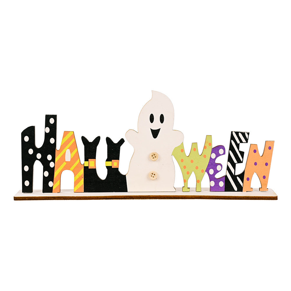 A wooden Halloween sign spells out "Halloween" with a ghost in place of the "O".