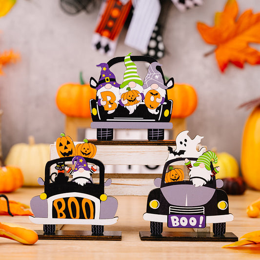 Three Halloween-themed car-shaped wooden ornaments featuring gnomes, pumpkins, and ghosts.