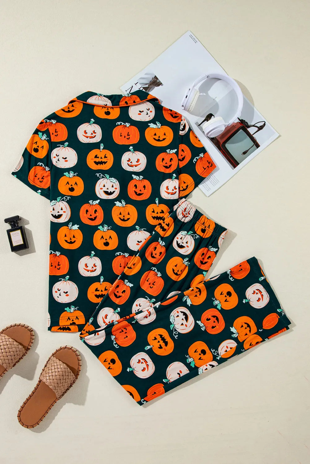 A dark green pumpkin-printed short sleeve top and pants lounge set is displayed.