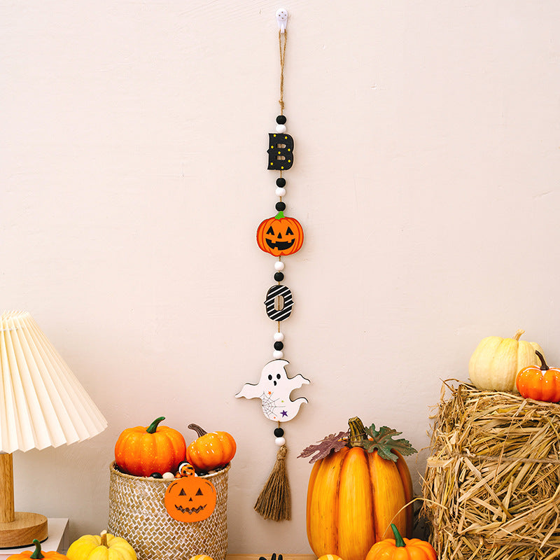 A Halloween hanging decoration featuring a "B," a pumpkin, an "O," and a ghost.
