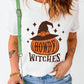 White short-sleeve t-shirt with a "Howdy Witches" pumpkin and witch hat graphic.