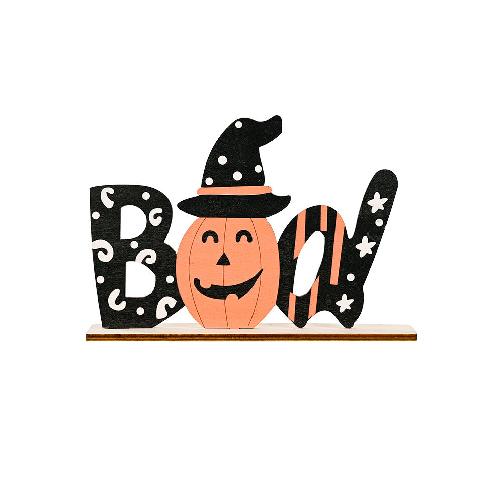 A wooden Halloween ornament spelling "Boo" with a pumpkin as the "o."