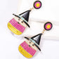 Two witch's hat dangle earrings with colorful synthetic pearls are displayed on a white surface.
