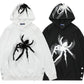 Two oversized hoodies, one white and one black, with spider graphics and side buttons.