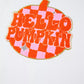 White long-sleeve sweatshirt with a "Hello Pumpkin" patch in orange and pink checkerboard.