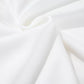 White fabric with soft folds and subtle texture.