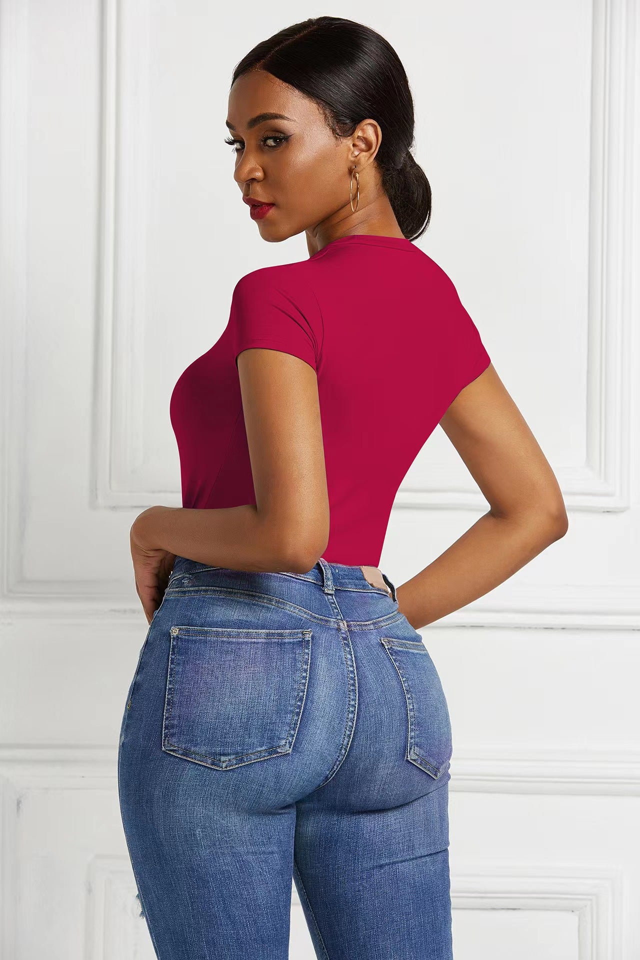 A base layer for a shaping garment