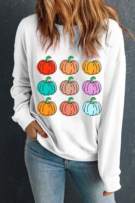 White long-sleeve sweatshirt with a colorful pumpkin graphic.