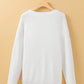 White round neck long sleeve sweater on a hanger.