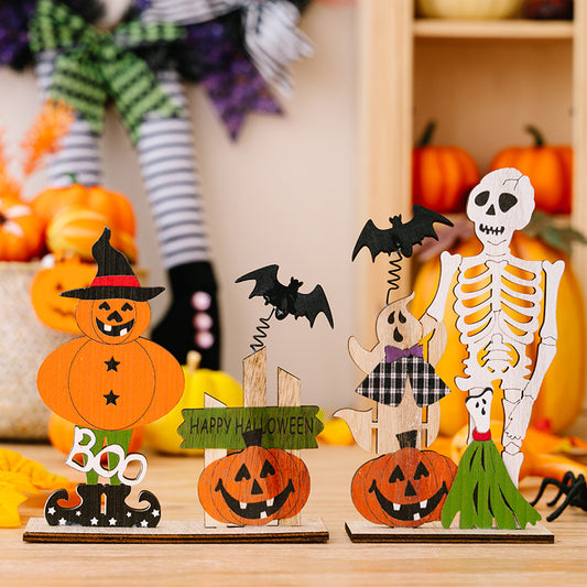 Two wooden Halloween ornaments featuring a pumpkin scarecrow and a skeleton with a ghost.