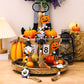 Three wooden Halloween element hanging widgets featuring gnomes, pumpkins, and a bat car.