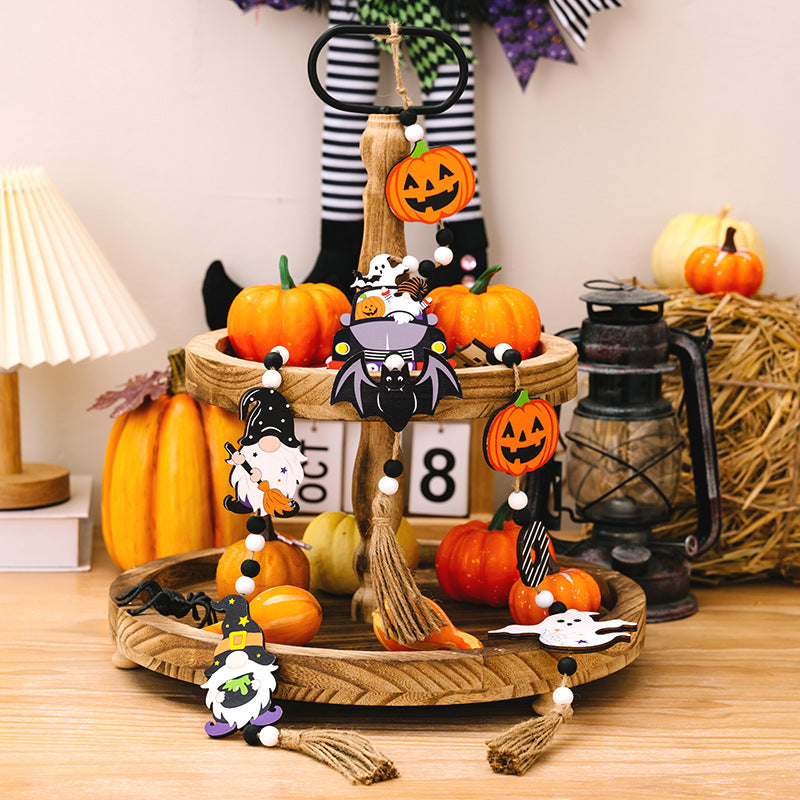 Three wooden Halloween element hanging widgets featuring gnomes, pumpkins, and a bat car.