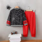 Black spiderweb baseball collar top with red sleeves and matching red pants.