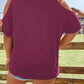 Plus size cold shoulder t-shirt in a solid maroon color.